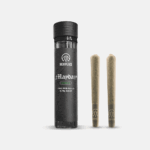 small glass jar, with black high peaks mayday label on it and 2 high peaks mayday pre- rolls. on grey background 